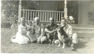 Grandma, me, Grandpa, Uncle Edward, Dad by front porch.